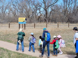 kids on a field trip into a park