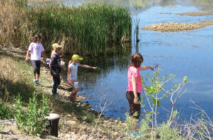 kids by a lake